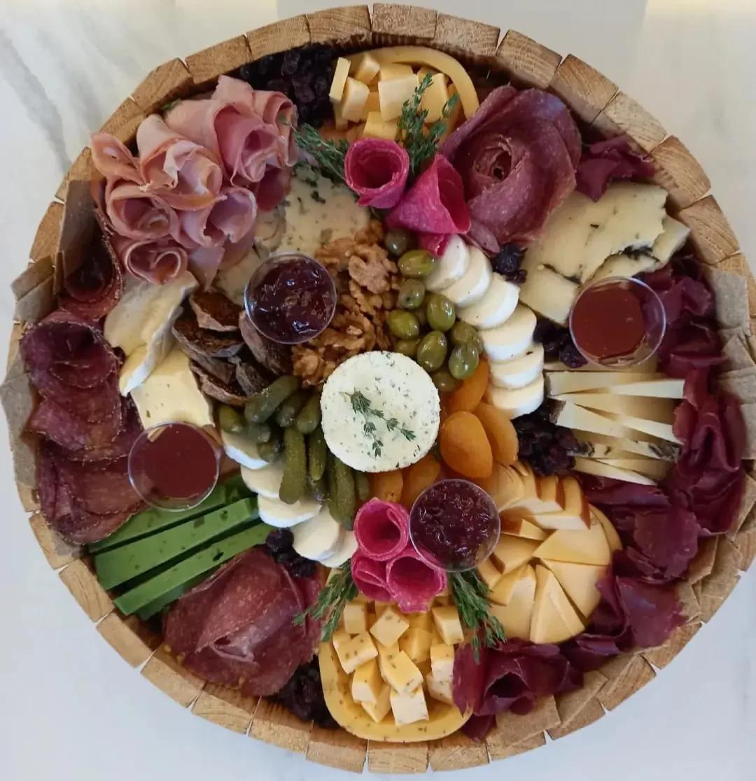 Round platter with dips and dried fruit