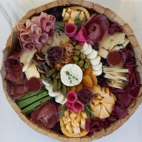 Round platter with dips and dried fruit